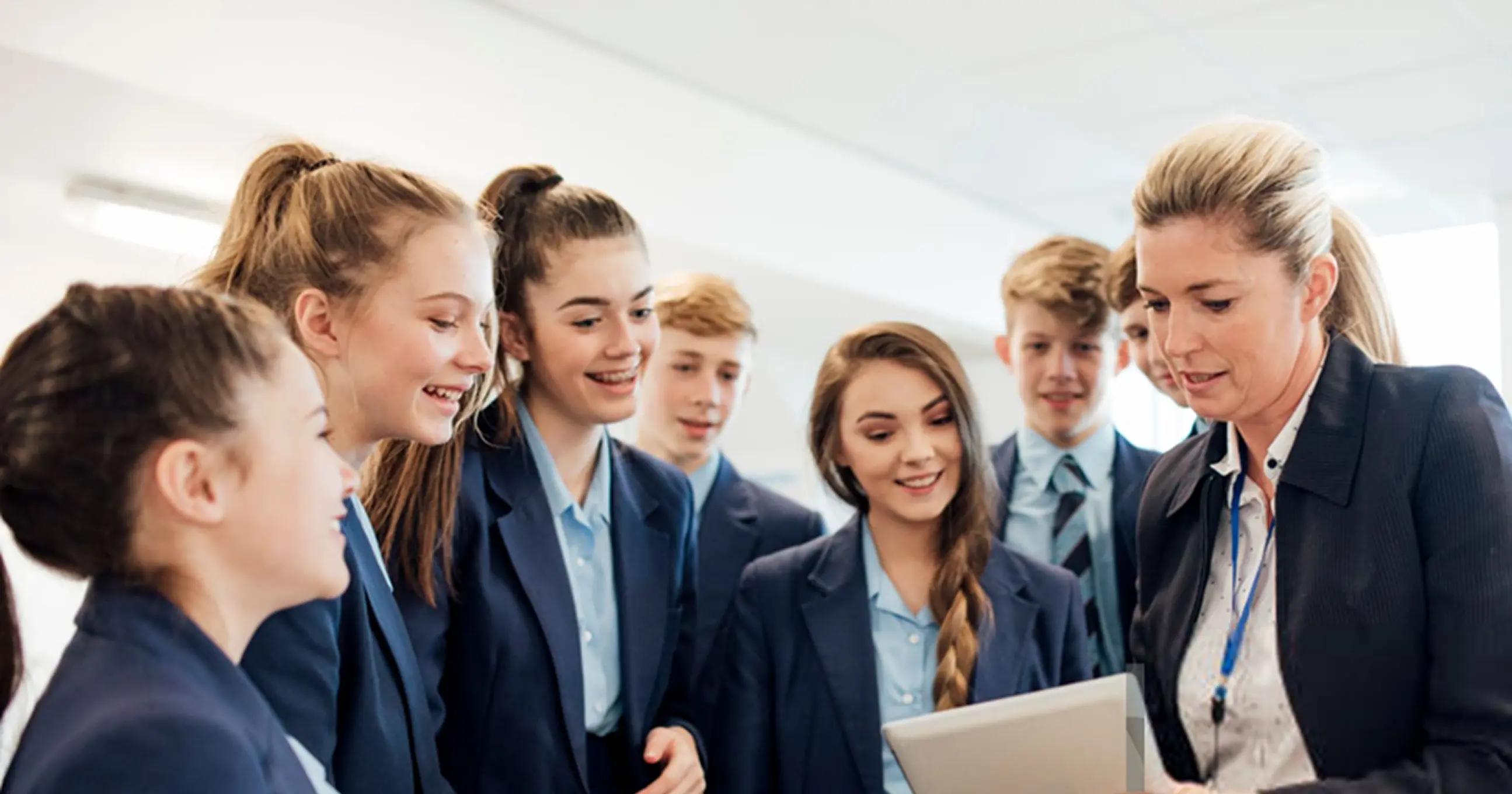 The teacher is telling something to the students