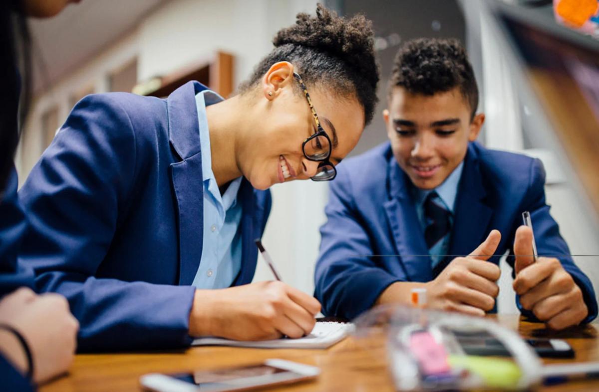 Students work with notebooks